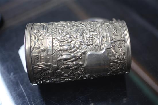 A mid-19th century Chinese silver mug, the body featuring warriors fighting to one side, with inscribed shield plaque H.13cm.